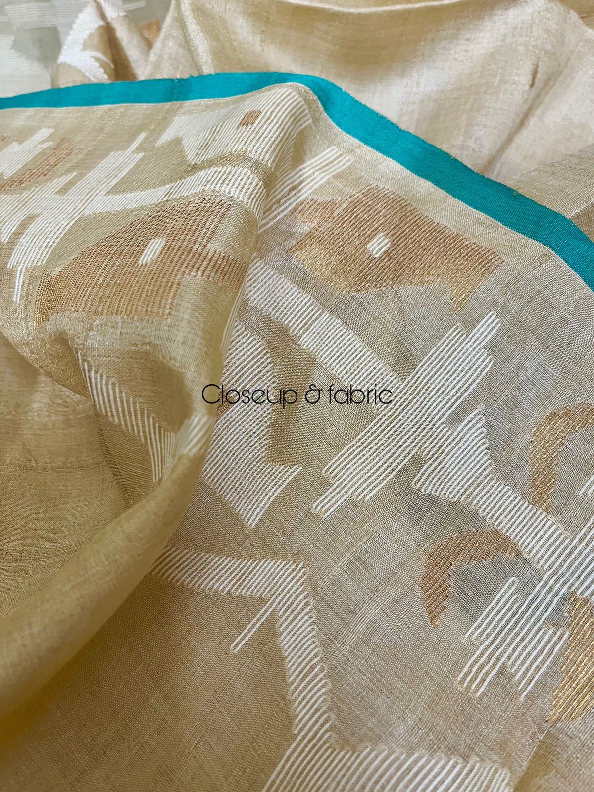 Beige with firoza border traditional handwoven jamdani saree in tusser silk
