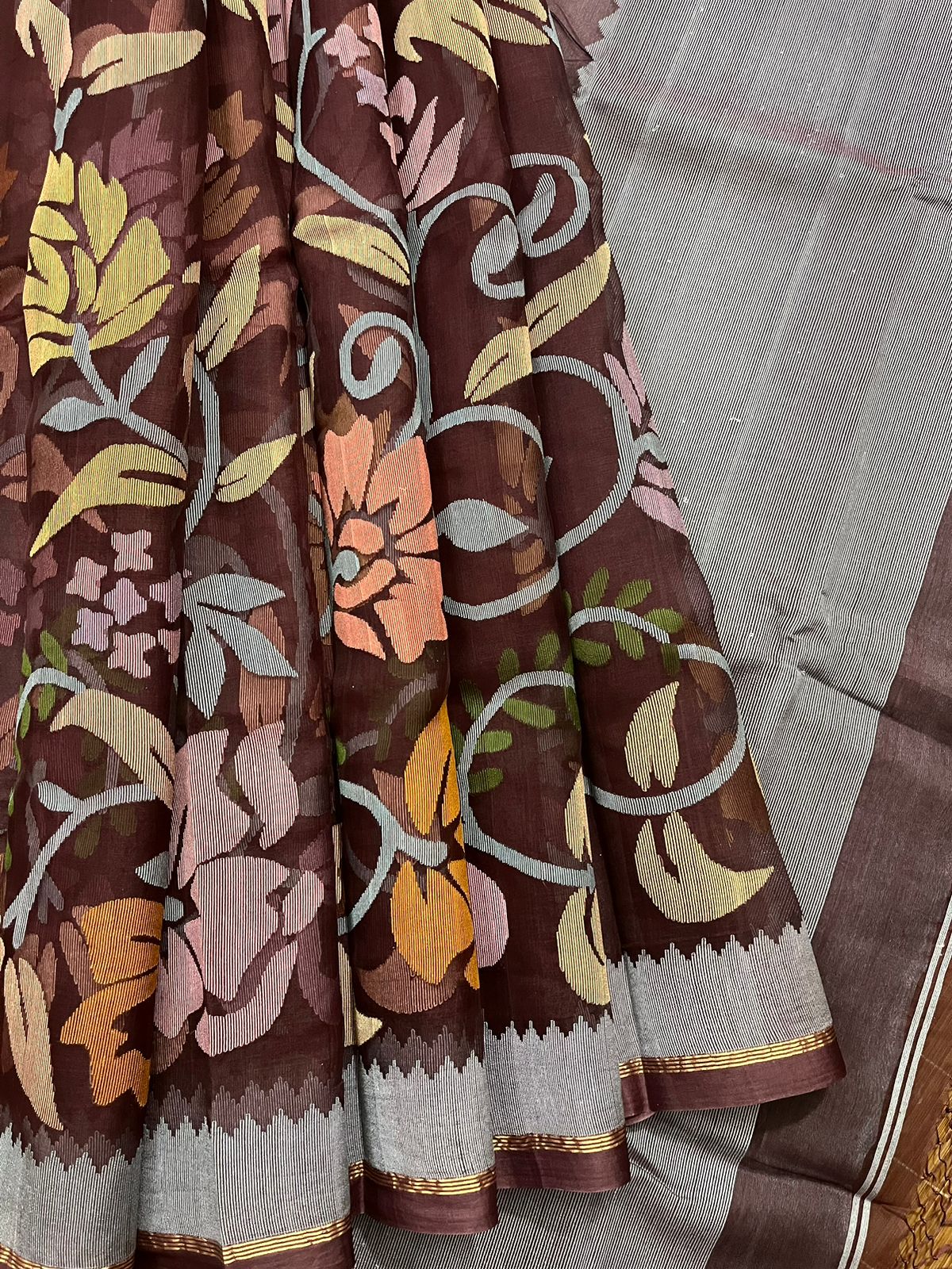 Chocolate brown with multi colour muslin silk allover floral with temple border  handwoven jamdani saree