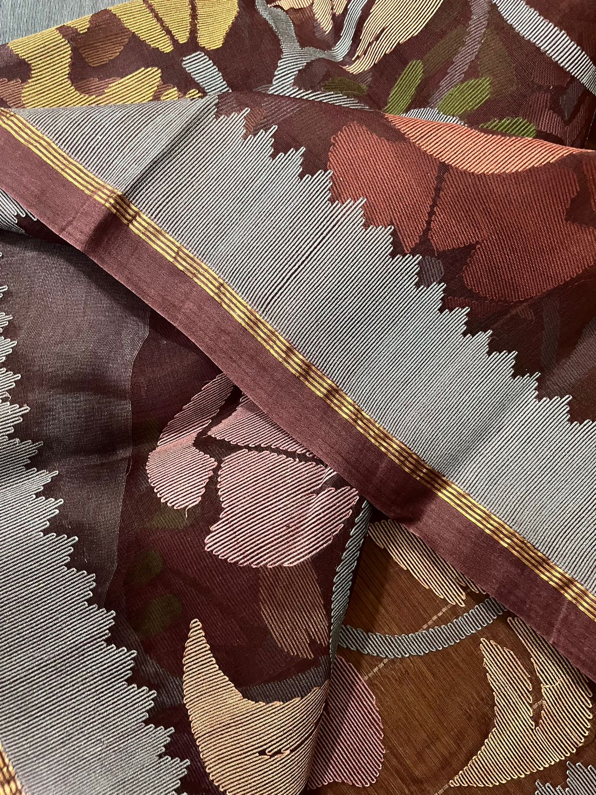 Chocolate brown with multi colour muslin silk allover floral with temple border  handwoven jamdani saree