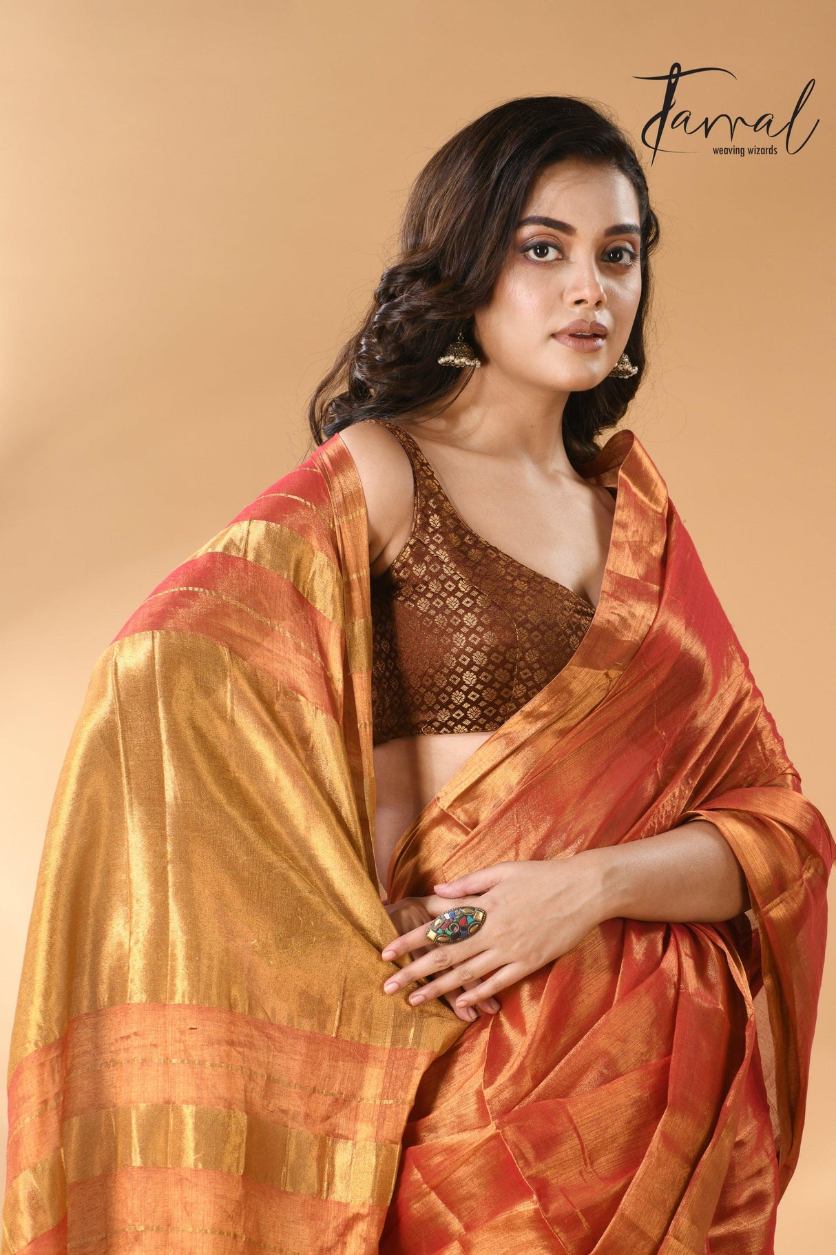 Golden orange tissue handloom saree closeu