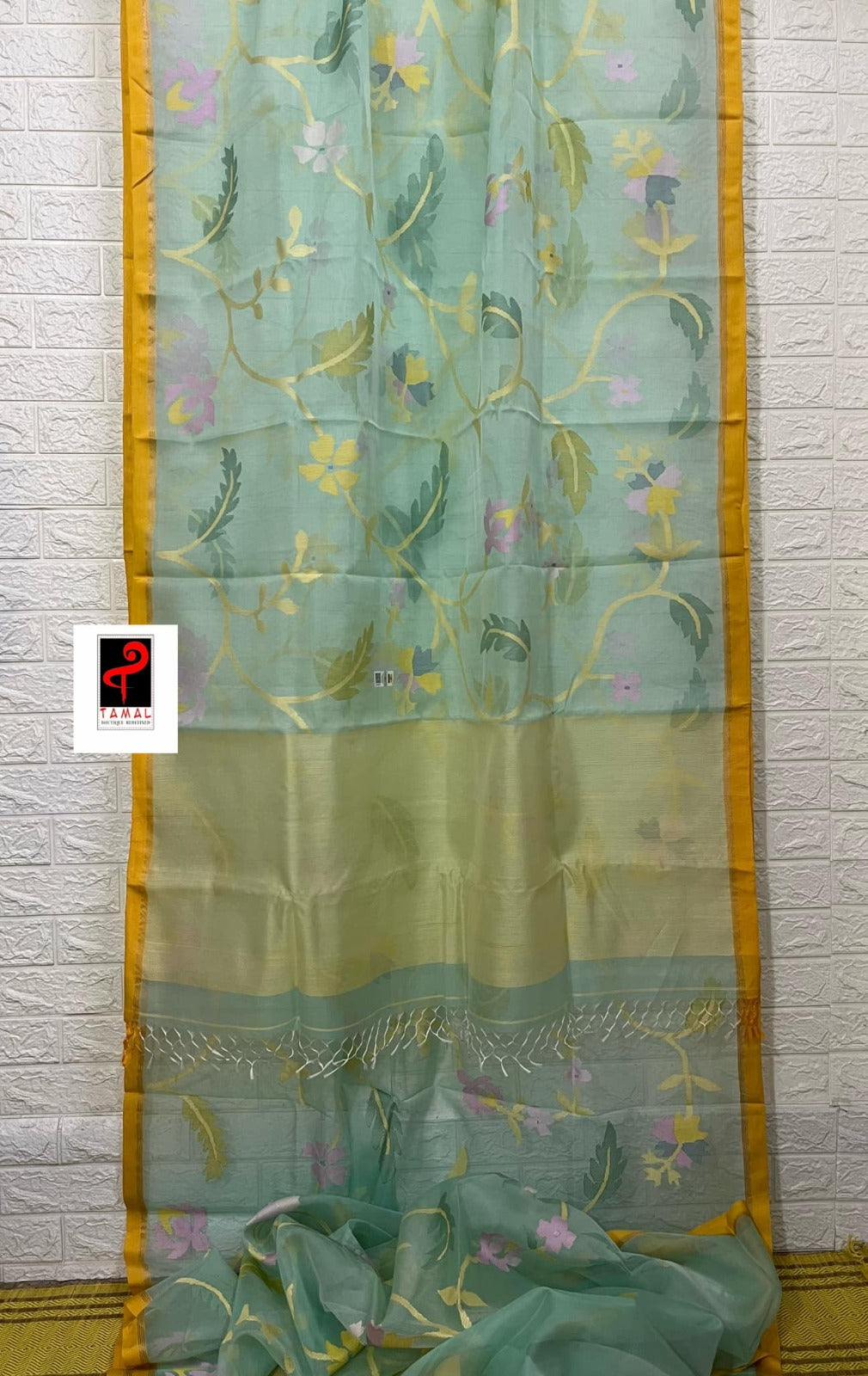 Light Firoza with yellow border allover hibiscus & other floral motifs handwoven jamdani saree in muslin silk