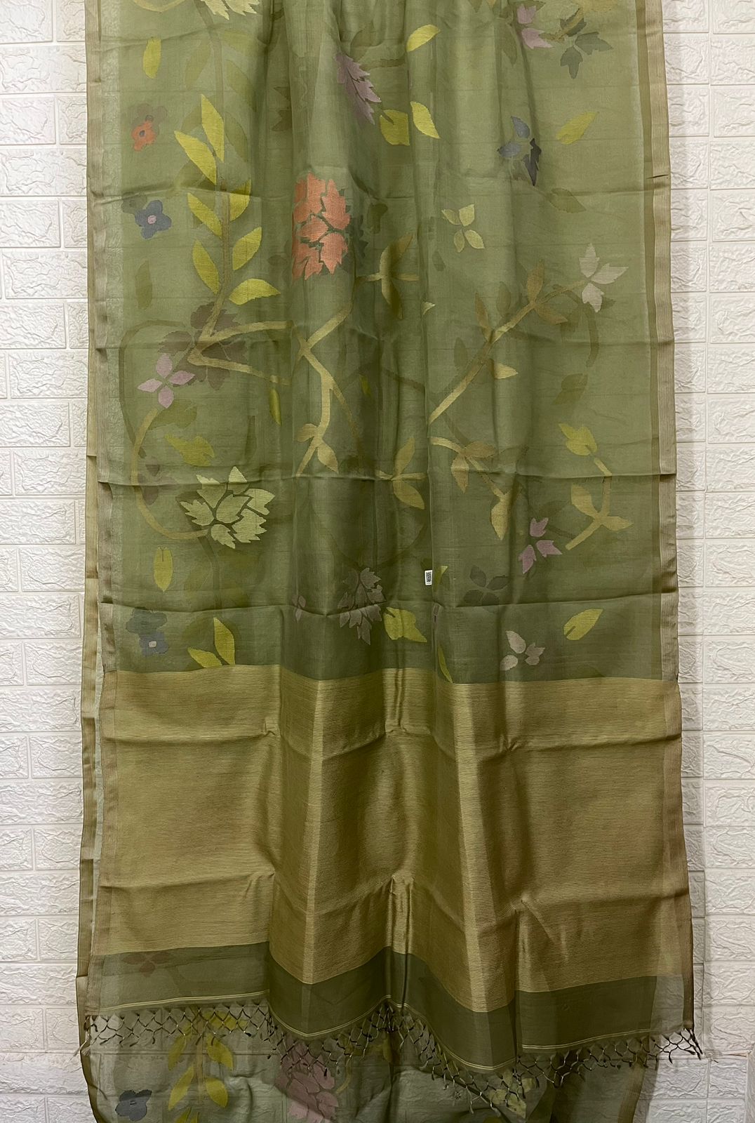 Moss green with allover floral handwoven muslin silk jamdani saree