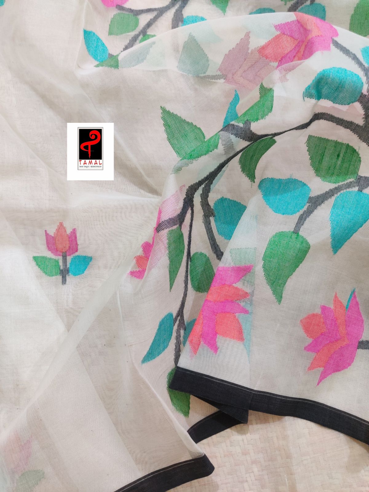 Off white with black border muslin floral buta handwoven jamadani saree