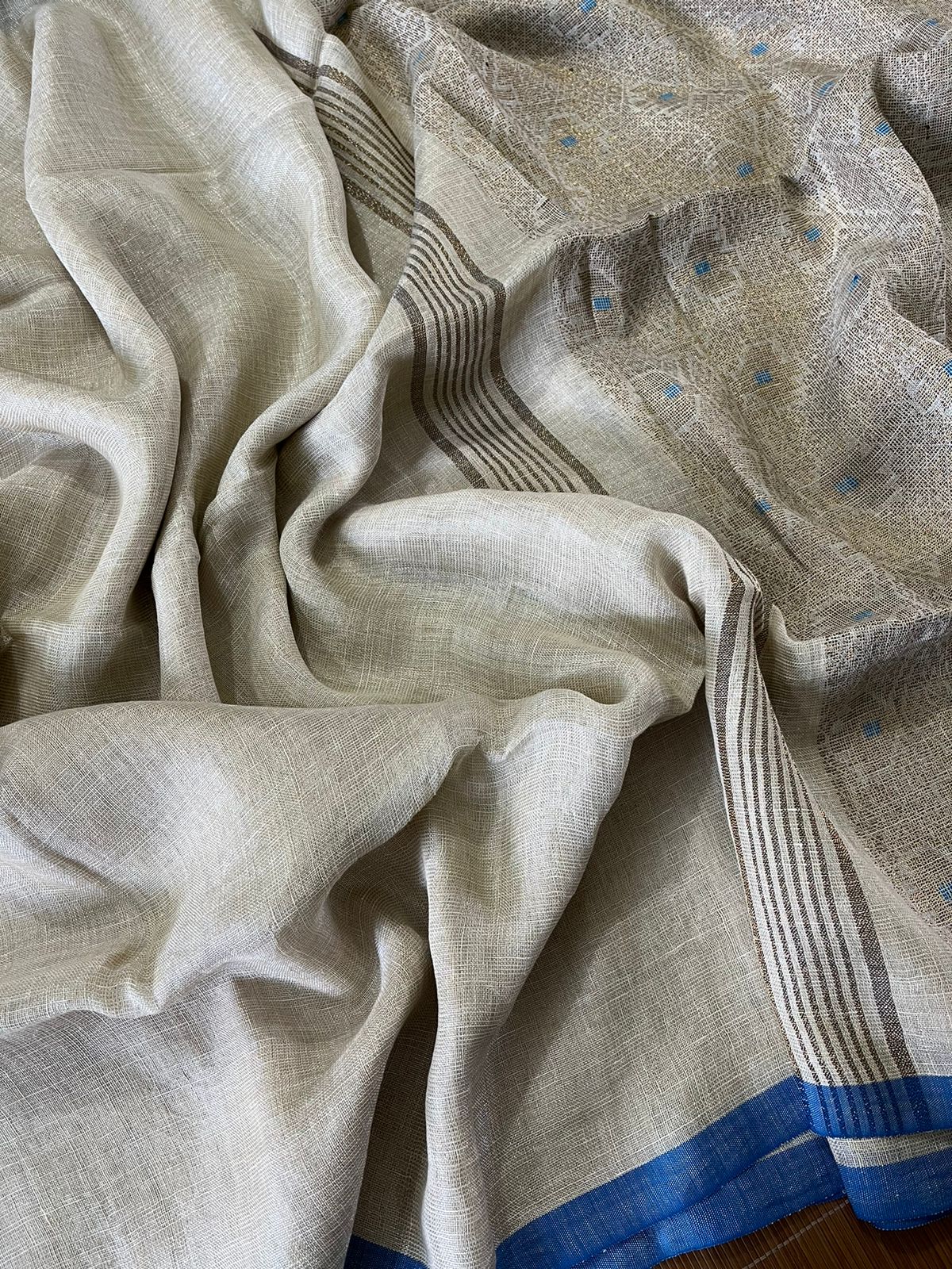 Offwhite with blue border tissue linen handloom jamdani saree