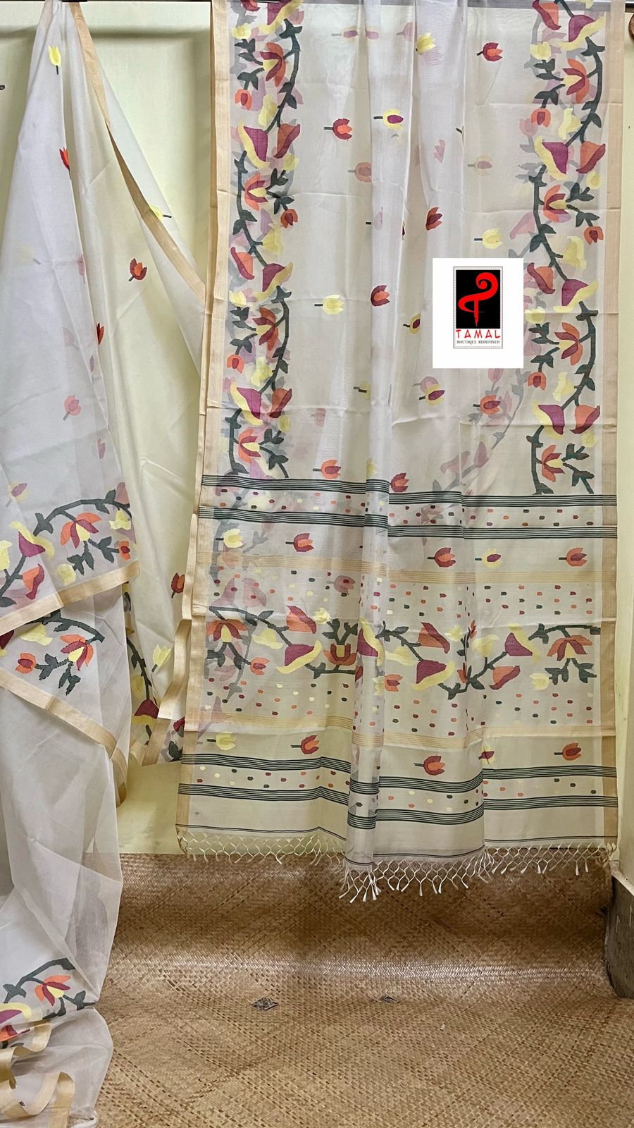 Off white with multi colour kalmilata floral handwoven muslin silk jamdani saree