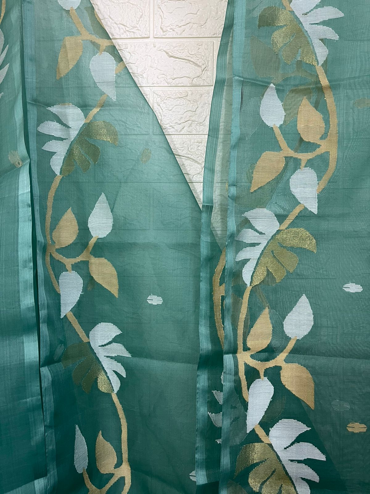 Pine green with white & zari lata motifs muslin silk handwoven jamdani saree