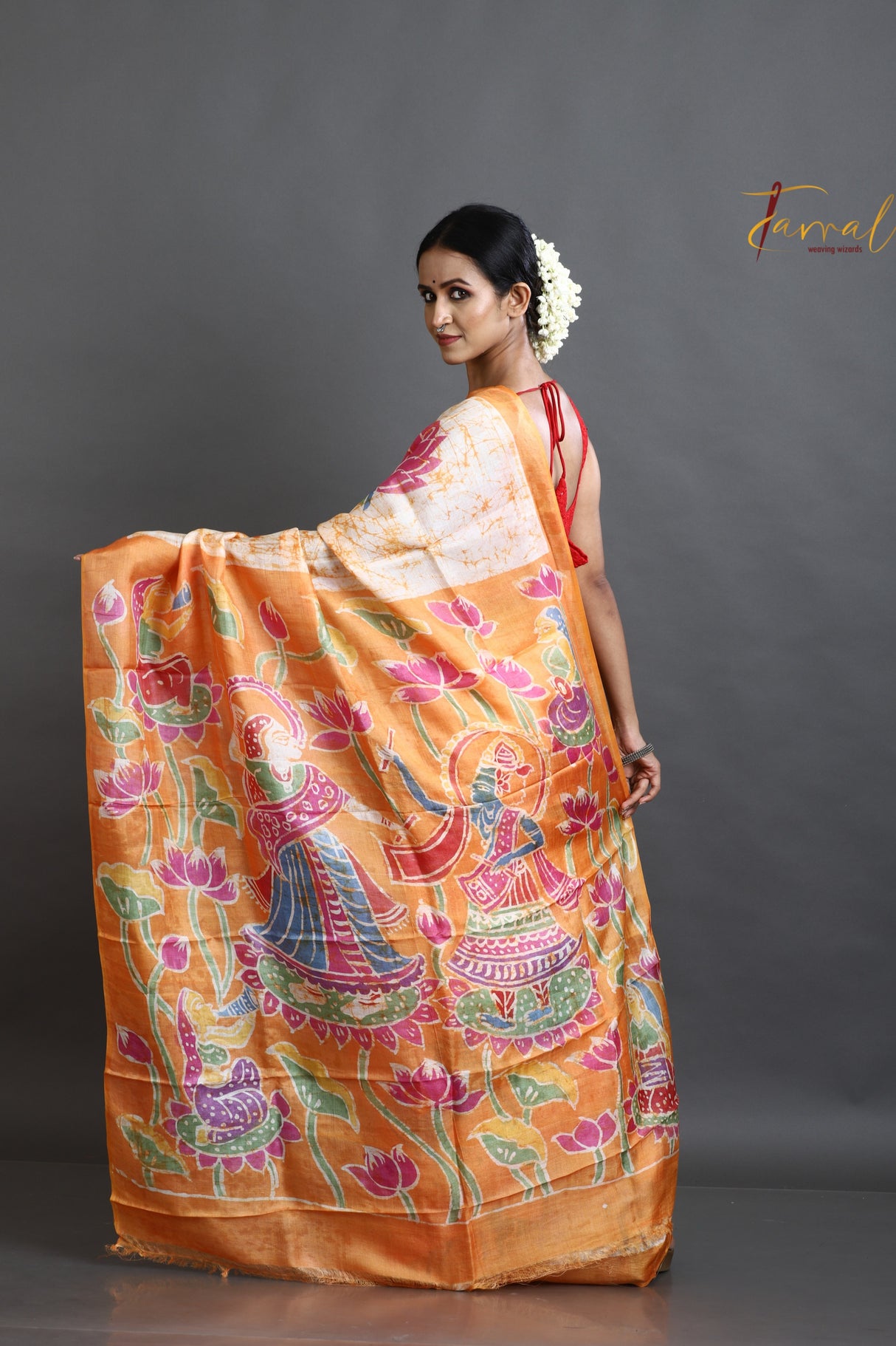 Offwhite with orange lotus motifs hand batik tussar silk saree