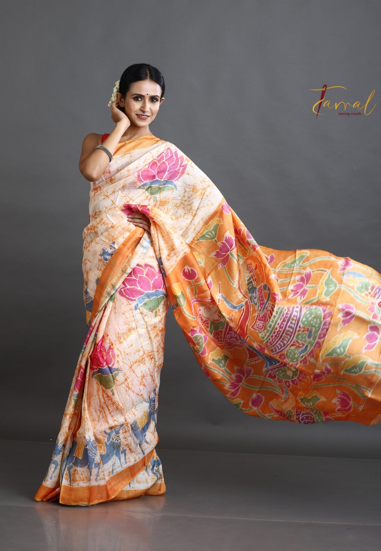 Offwhite with orange lotus motifs hand batik tussar silk saree