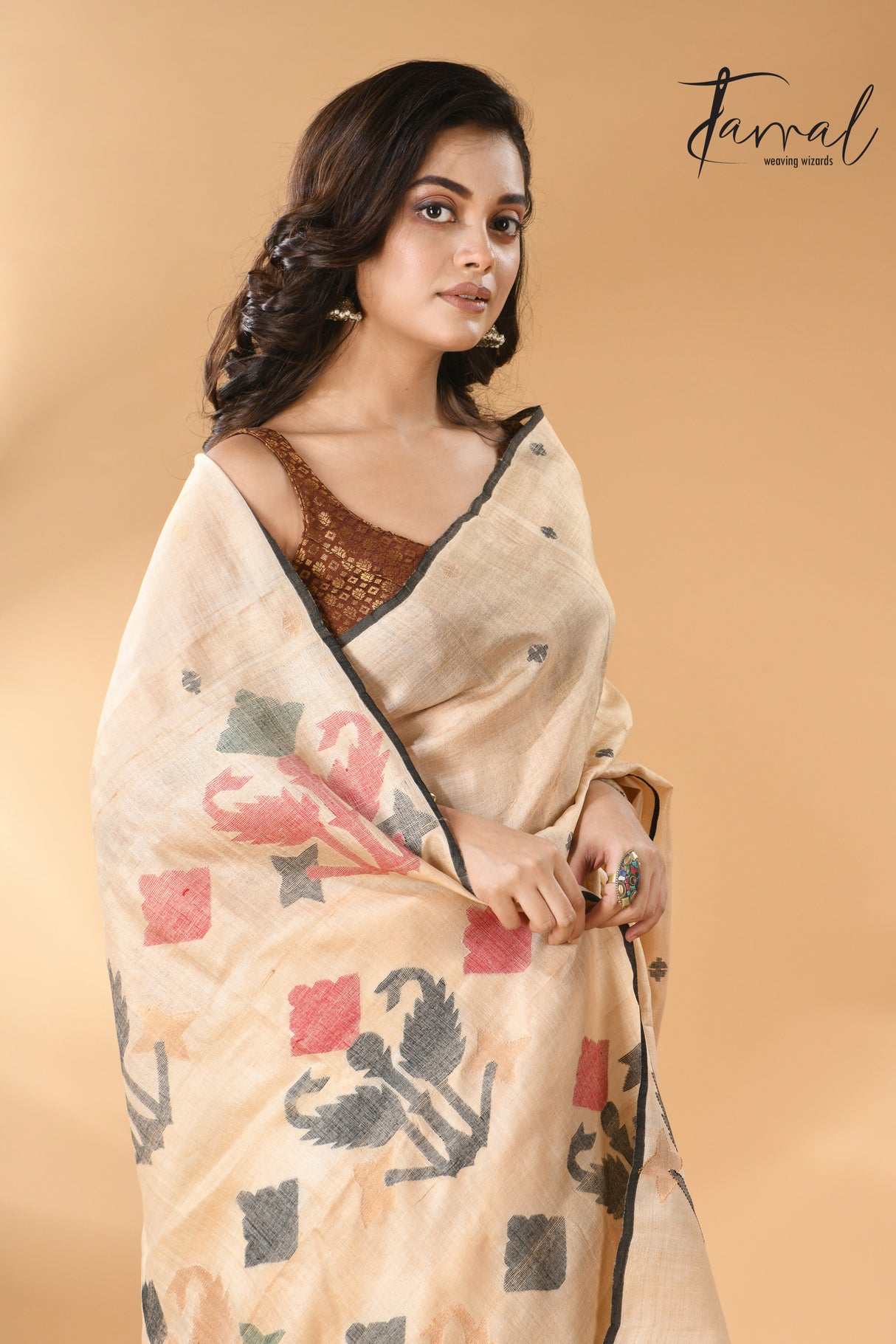 Light beige colour with black border pure tissue neddle work tusser jamdani saree