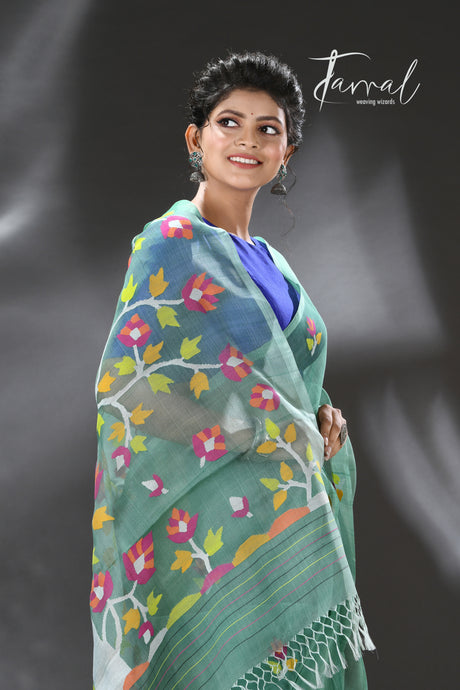 Pine green with blossom tree pallu muslin silk handwoven jamdani saree