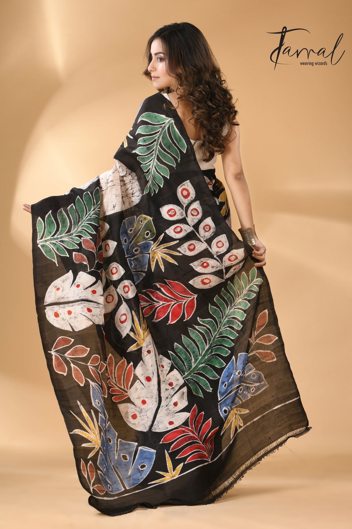 Off white with multi colour leaves hand batik design in katan silk saree