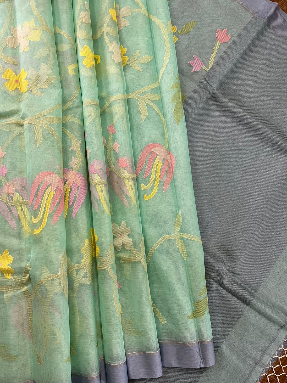 Turquoise blue with multi colour allover floral handwoven muslin silk jamdani saree - Tamal Boutique