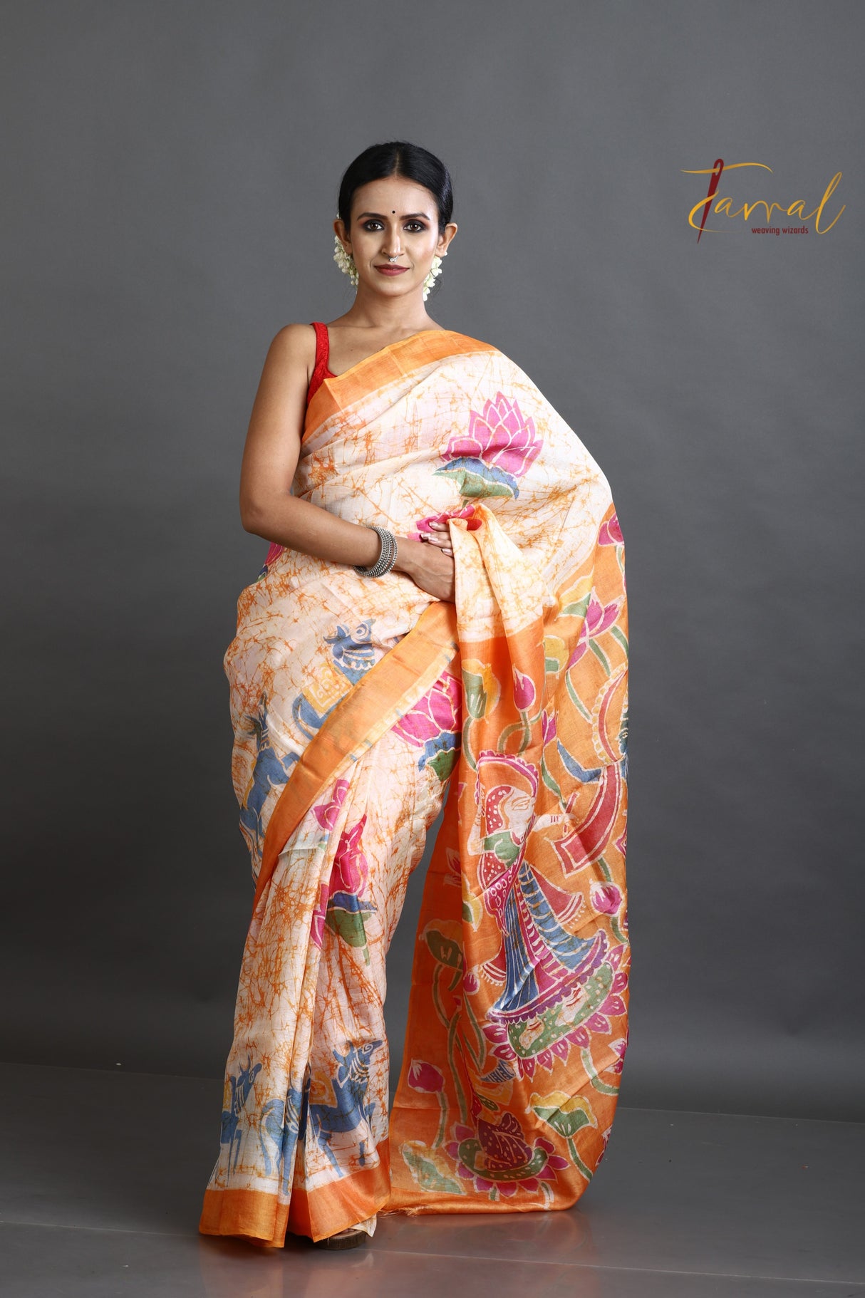 Offwhite with orange lotus motifs hand batik tussar silk saree