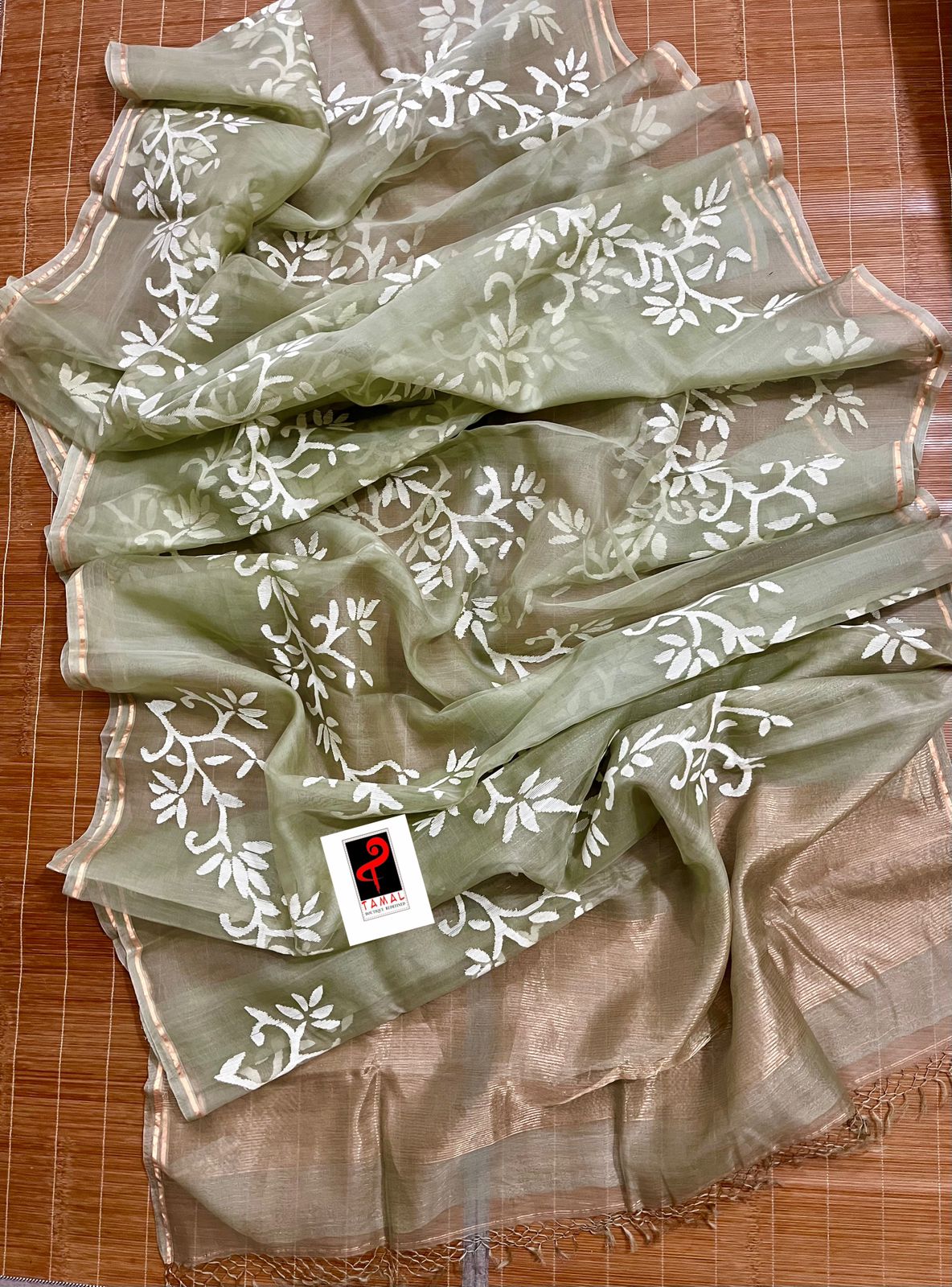 Light mint green with white allover floral handwoven jamdani in muslin silk saree