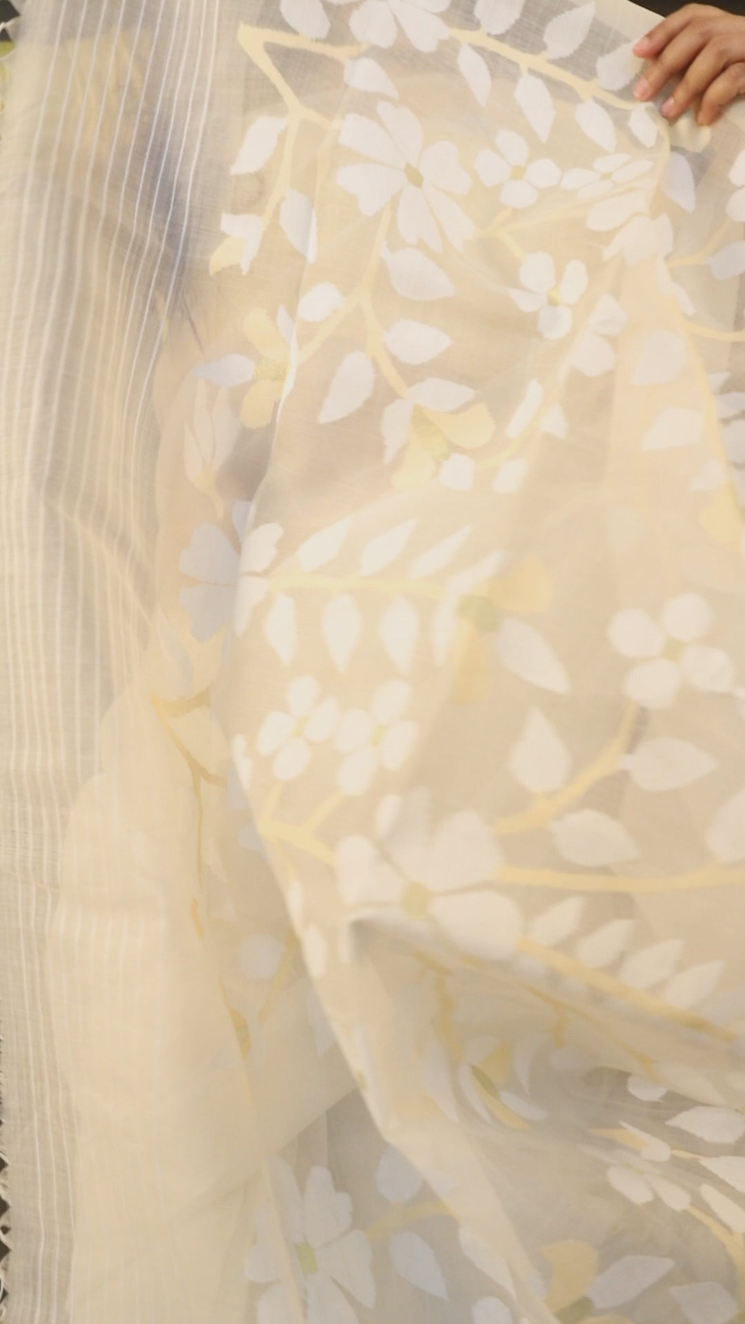 White self with beige colour floral handwoven muslin silk jamdani saree